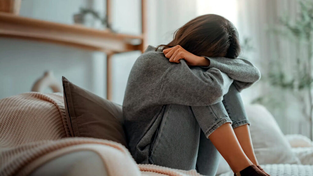 Person experiencing depression symptoms and emotional numbness seeking help