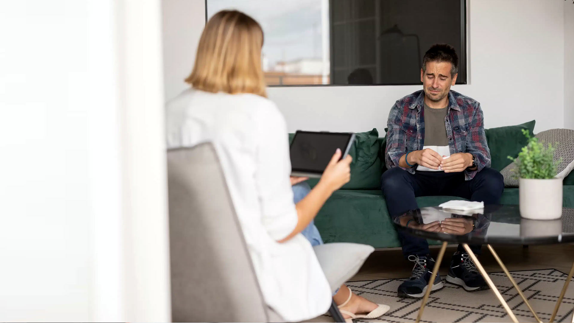 Work Stress Therapy Session Therapist helping professional with work stress in West Palm Beach office